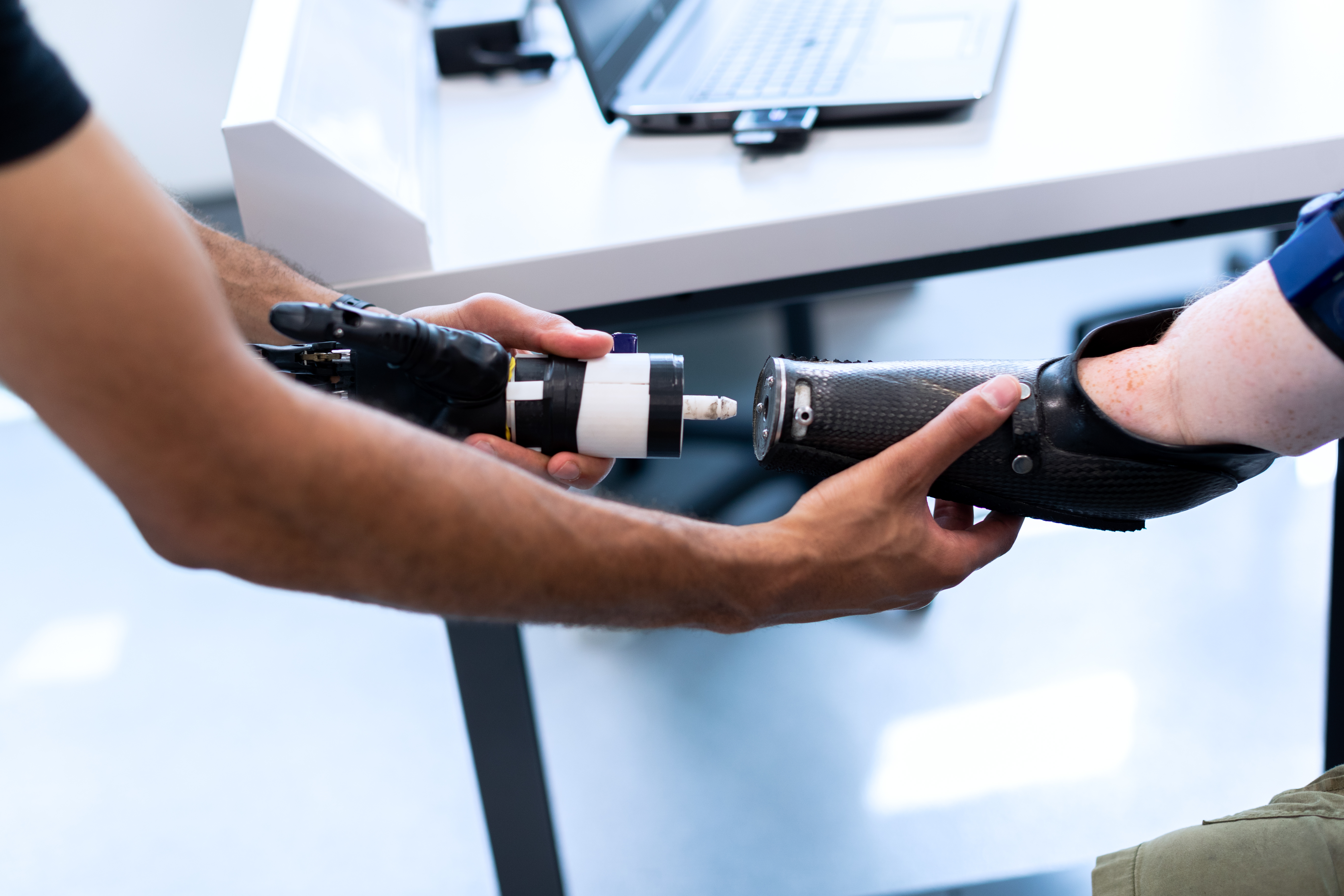 Person Holding Prosthetic Arm 